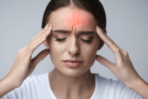 Girl experiencing headache